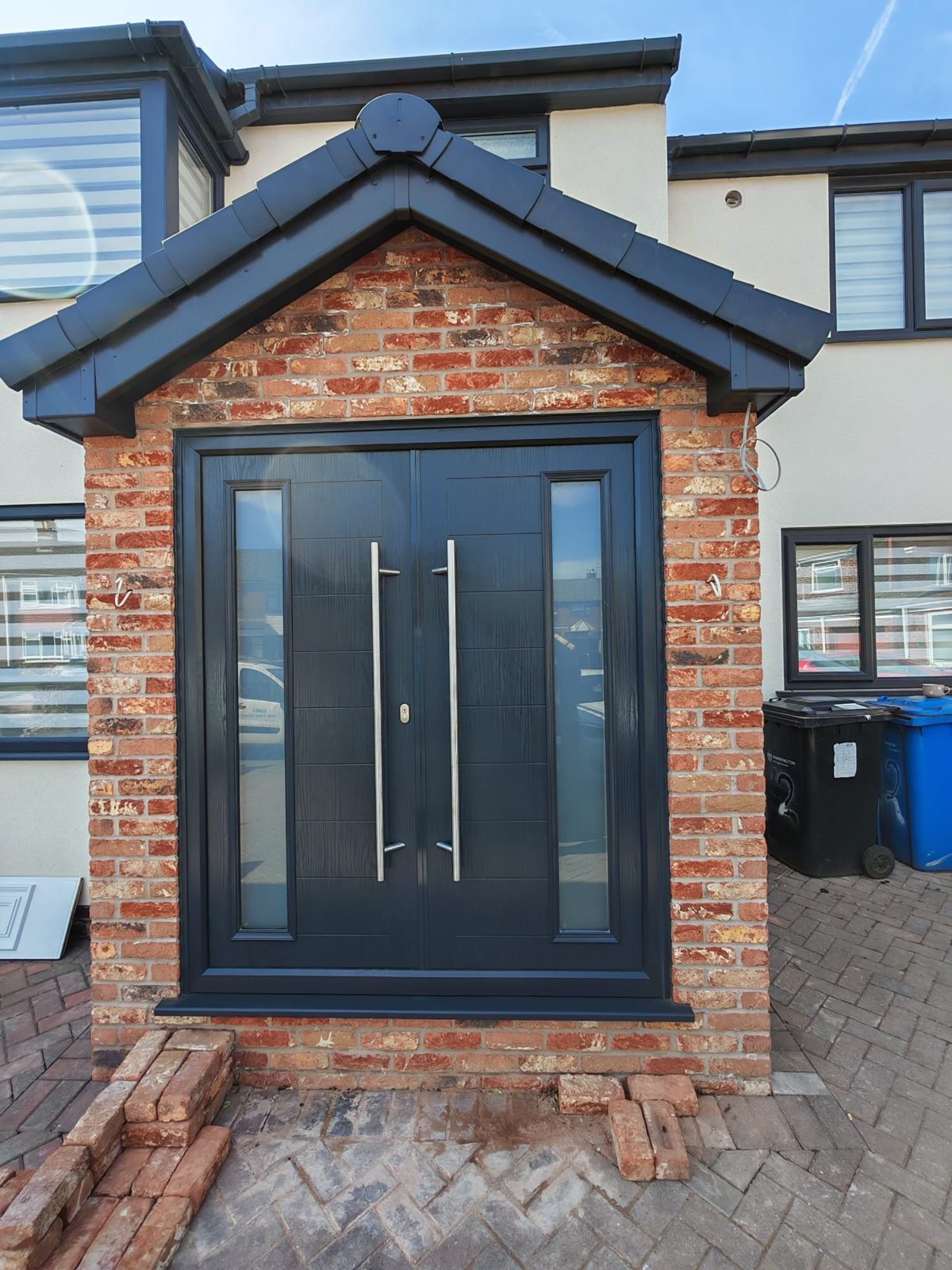 New brick porch with an anthracite front door, Longmore Construction, Warrington