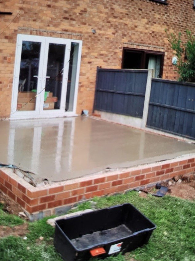 New floor slab poured inside the base of a rear extension