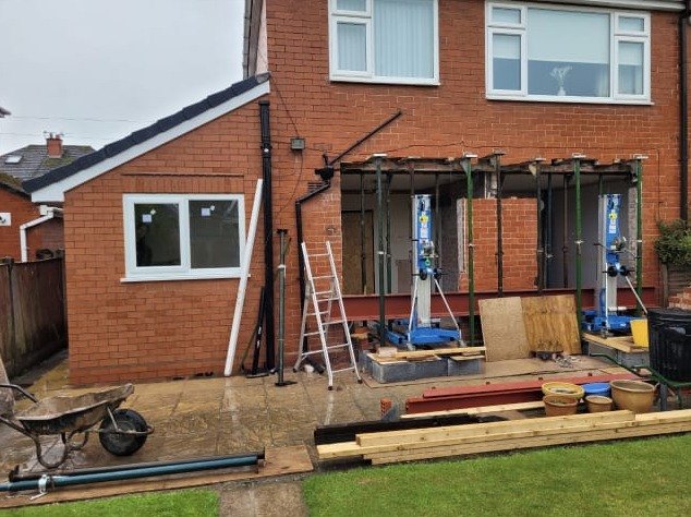 Acrow props holding the back wall while a rear extension is built